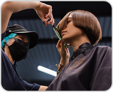 landing-page_Sophida_Finish_0004_professional-girl-hairdresser-makes-client-haircut-girl-is-sitting-mask-beauty-salon